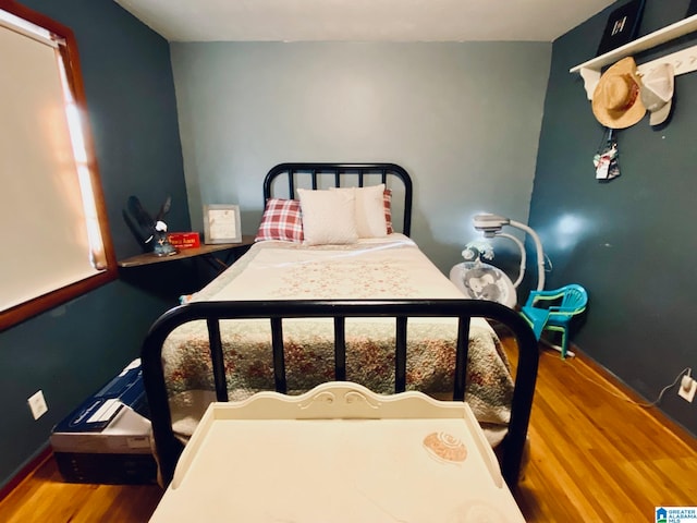 bedroom featuring wood-type flooring