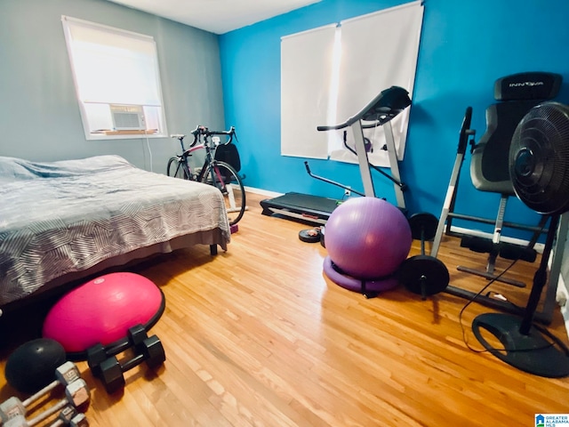 bedroom with hardwood / wood-style floors