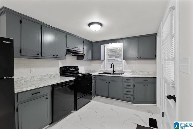 kitchen featuring gray cabinetry, decorative backsplash, sink, and black appliances