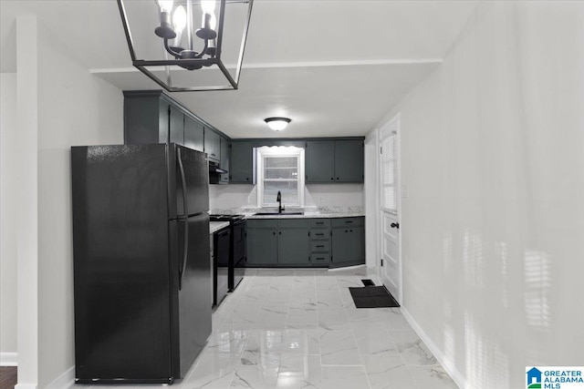 kitchen with a chandelier, sink, black appliances, and ventilation hood