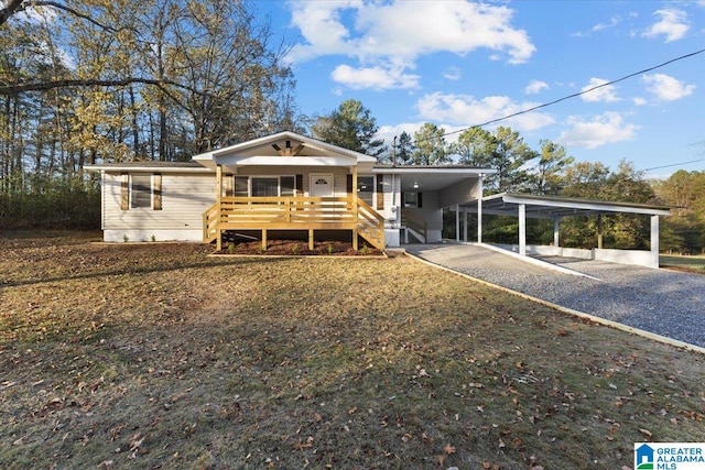 view of front of property with a porch and a carport