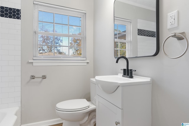 full bathroom featuring vanity, toilet, a wealth of natural light, and tiled shower / bath combo