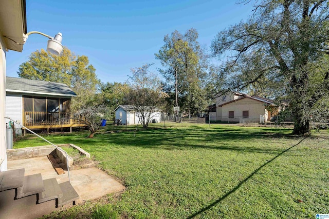 view of yard featuring a patio and a sunroom