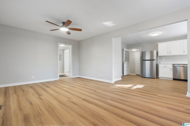 unfurnished living room featuring ceiling fan and light hardwood / wood-style floors