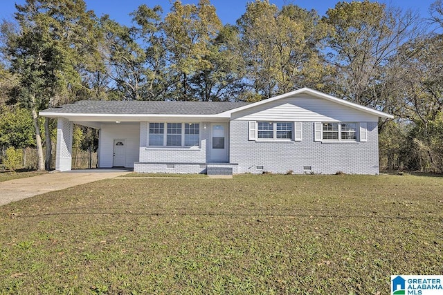6129 Spruce Dr, Anniston, AL 36206 - single story home featuring crawl space, a front yard, concrete driveway, an attached carport, and brick siding