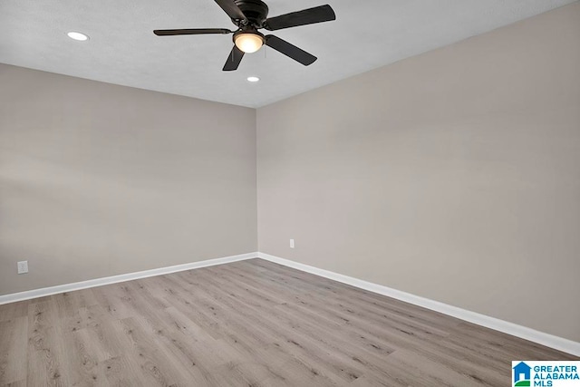 unfurnished room featuring ceiling fan and light wood-type flooring