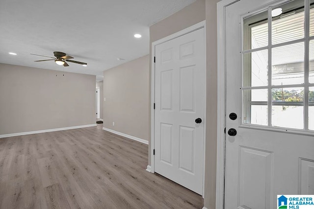 foyer featuring light hardwood / wood-style flooring and ceiling fan