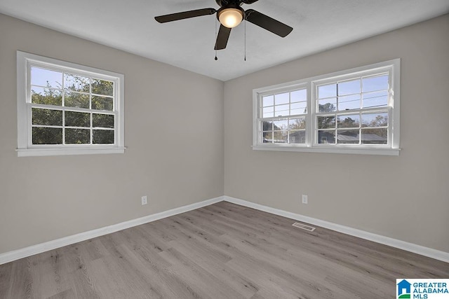 6129 Spruce Dr, Anniston, AL 36206 - unfurnished room with healthy amount of natural light, wood finished floors, baseboards, and a ceiling fan