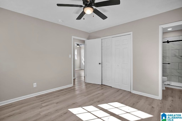 unfurnished bedroom featuring connected bathroom, ceiling fan, a closet, and light hardwood / wood-style floors