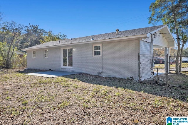 rear view of property with a patio area