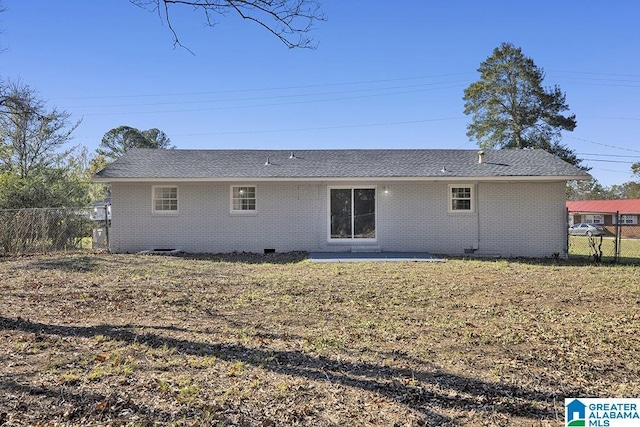 6129 Spruce Dr, Anniston, AL 36206 - back of property featuring brick siding, a patio, a shingled roof, and crawl space
