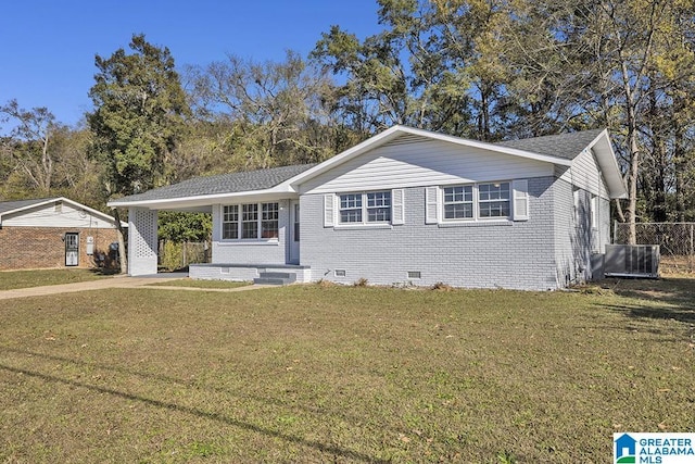6129 Spruce Dr, Anniston, AL 36206 - view of front of home featuring crawl space, a carport, brick siding, cooling unit, and roof with shingles