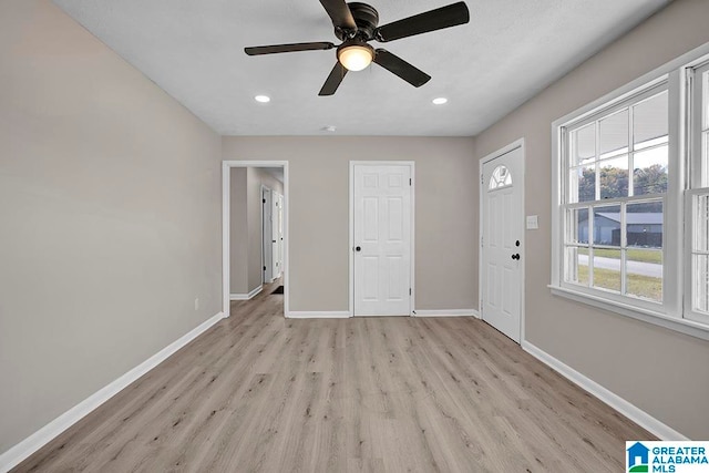 interior space featuring light hardwood / wood-style floors and ceiling fan