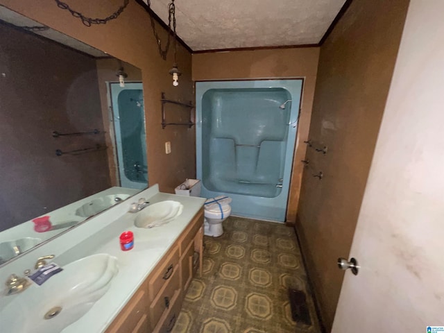 full bathroom with tub / shower combination, crown molding, a textured ceiling, toilet, and vanity