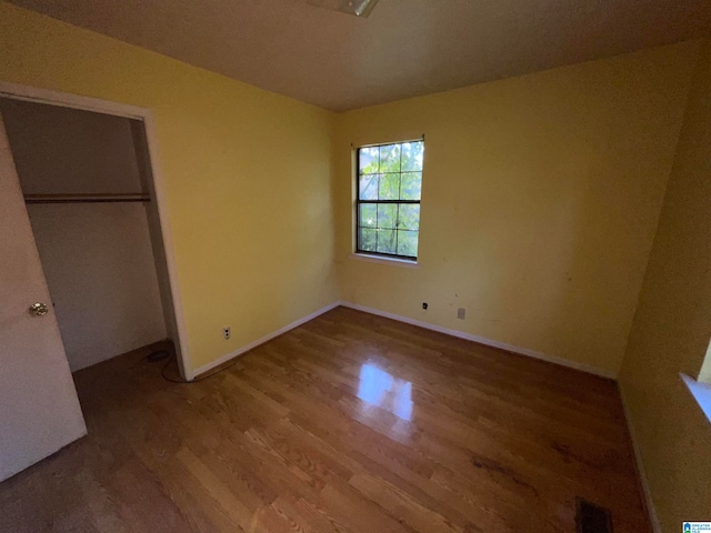 unfurnished bedroom featuring hardwood / wood-style floors