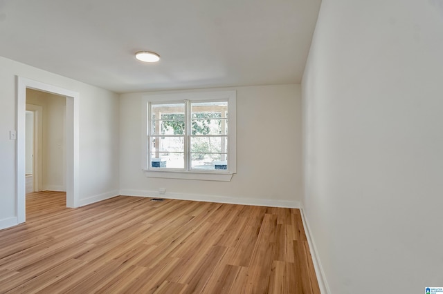 unfurnished room featuring light wood-type flooring