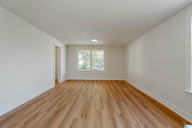 spare room featuring light hardwood / wood-style floors