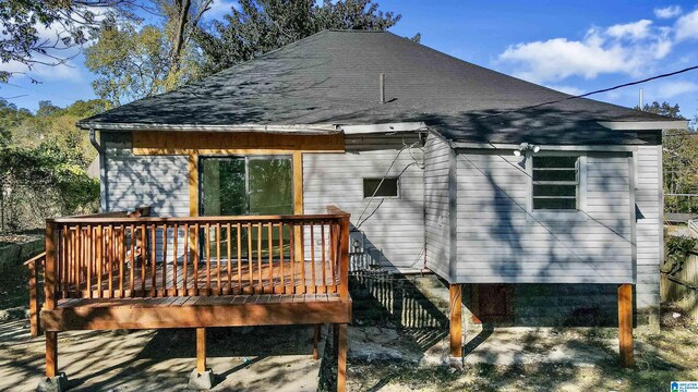 back of property with a wooden deck