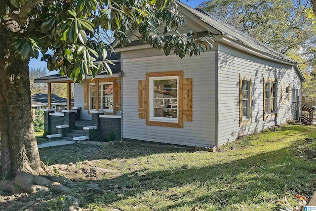 view of home's exterior featuring a lawn