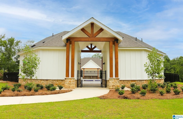 view of exterior entry with a yard