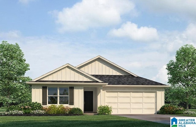 view of front of property featuring a garage and a front lawn