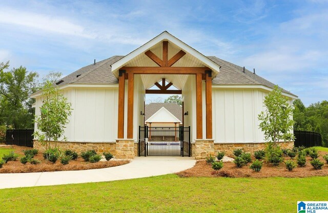 doorway to property featuring a lawn and a garage