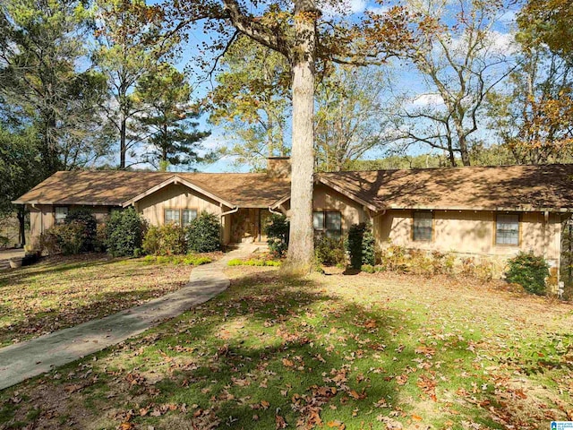 ranch-style home featuring a front yard