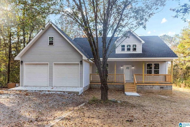 view of front facade featuring a porch and a garage