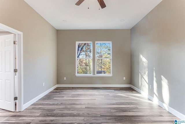 unfurnished room featuring ceiling fan and light hardwood / wood-style flooring