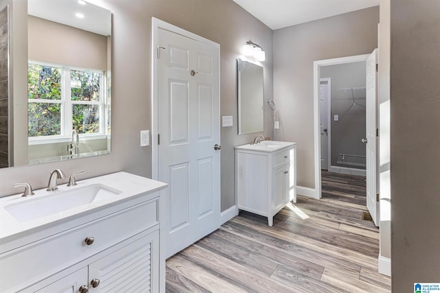 bathroom with vanity and wood-type flooring