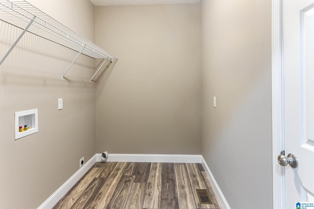 laundry area featuring hardwood / wood-style floors, electric dryer hookup, and washer hookup