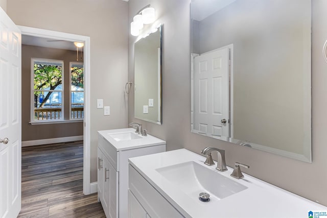 bathroom with hardwood / wood-style floors and vanity