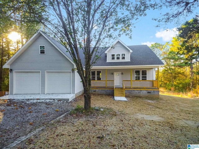 view of front of house with a garage and covered porch