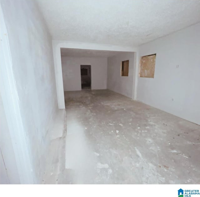 spare room featuring a textured ceiling