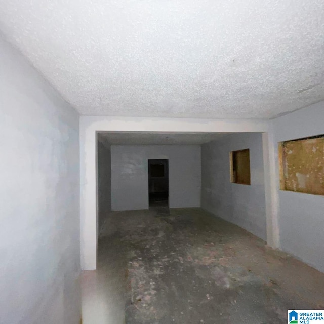 spare room featuring a textured ceiling