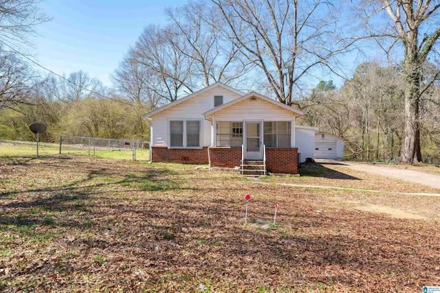 view of front of house featuring a garage and a front lawn