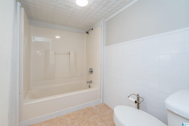 bathroom featuring crown molding, shower / tub combination, tile walls, tile patterned flooring, and toilet