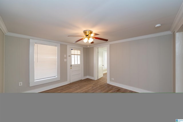 entryway with crown molding, ceiling fan, and light hardwood / wood-style floors