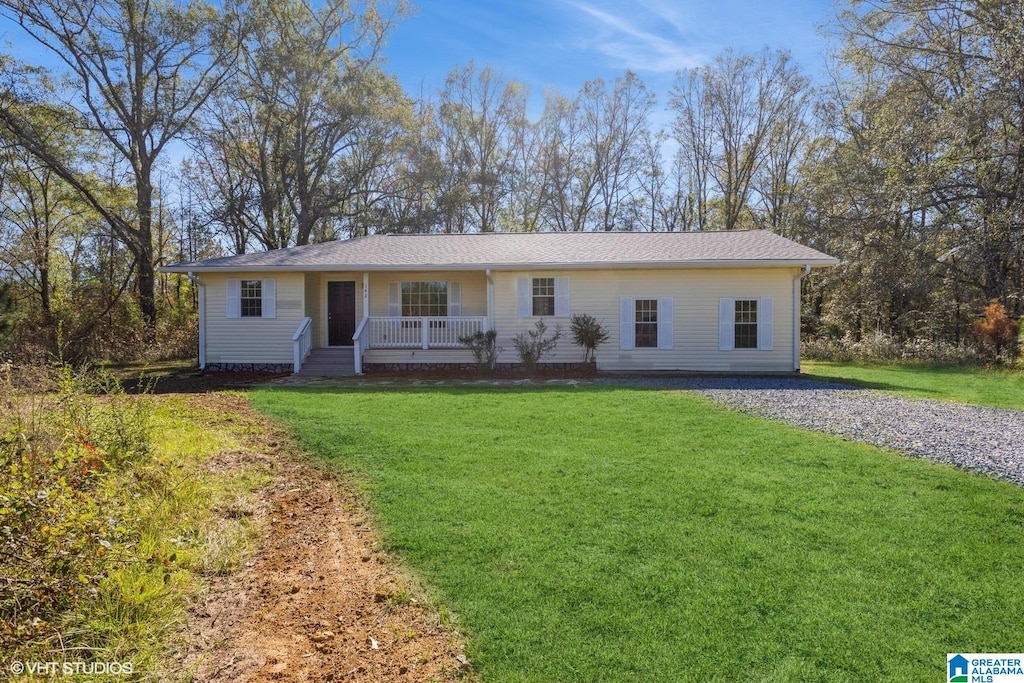 ranch-style home with a porch and a front lawn