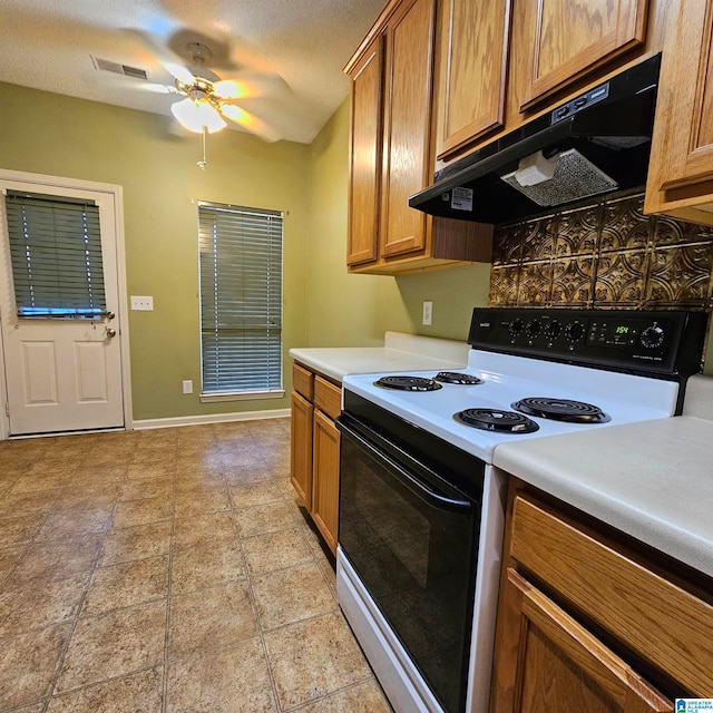 kitchen with backsplash, ceiling fan, a textured ceiling, range hood, and white electric range oven