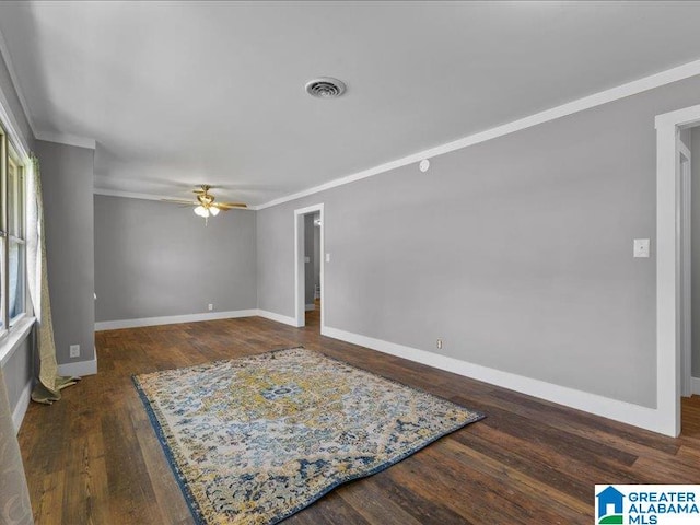 unfurnished room with ceiling fan, dark hardwood / wood-style floors, and ornamental molding