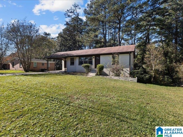 ranch-style home with a carport and a front lawn