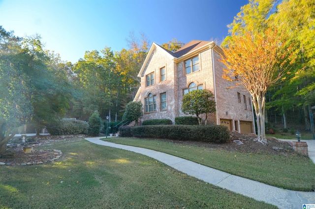 view of property exterior with a yard and a garage