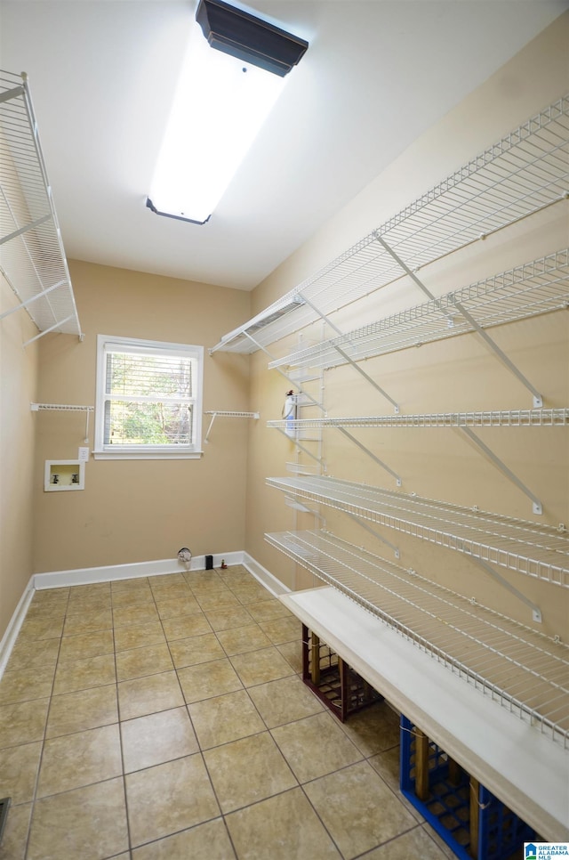 laundry area with hookup for a washing machine and tile patterned flooring