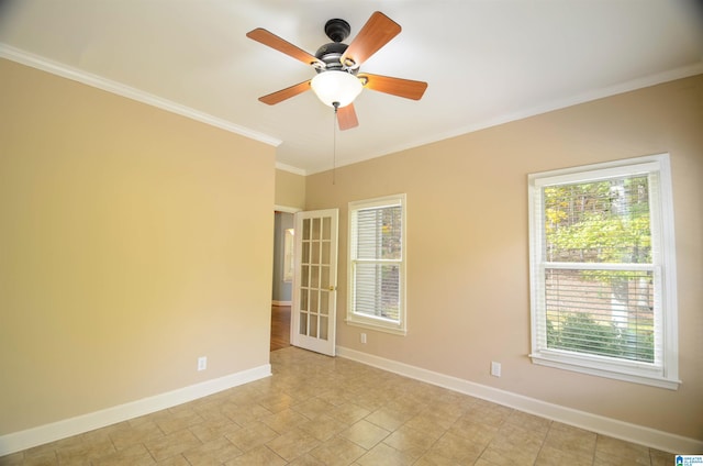 empty room with ceiling fan and crown molding