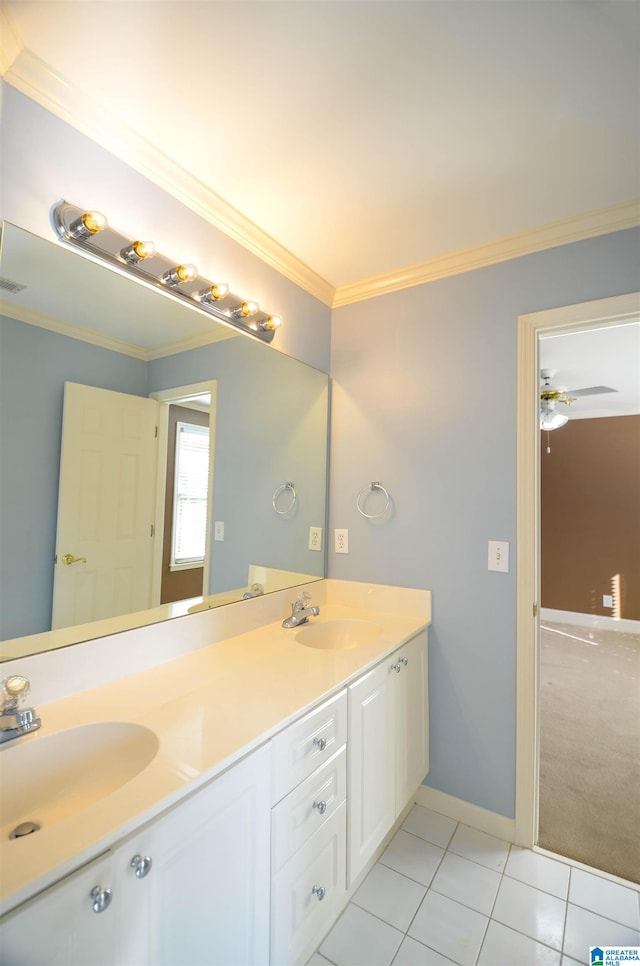 bathroom with ceiling fan, tile patterned flooring, vanity, and crown molding