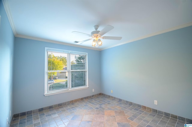 empty room featuring ceiling fan and crown molding