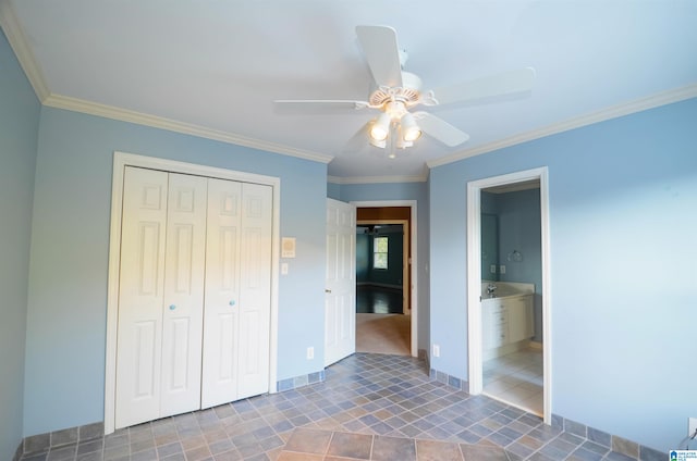 unfurnished bedroom featuring ceiling fan, ensuite bath, ornamental molding, and a closet