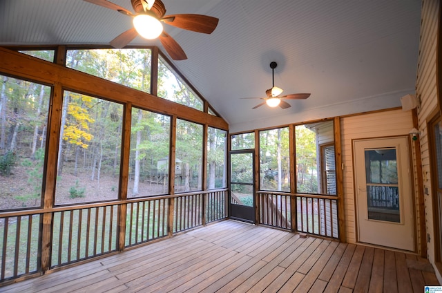 unfurnished sunroom featuring ceiling fan and vaulted ceiling