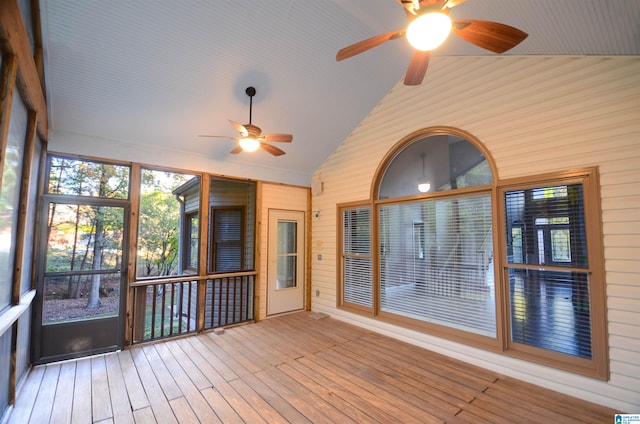 unfurnished sunroom featuring ceiling fan and lofted ceiling